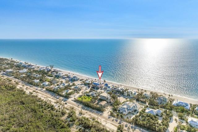 birds eye view of property with a water view and a residential view