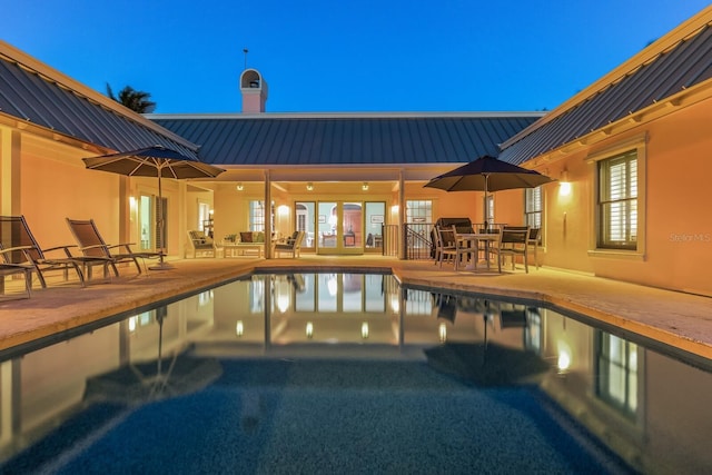 outdoor pool featuring a patio area and outdoor dining area