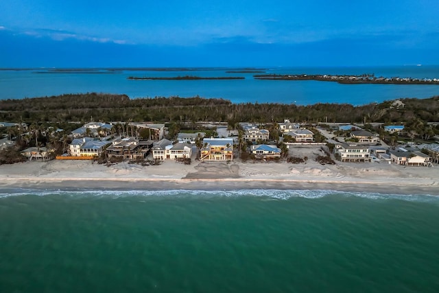 drone / aerial view featuring a water view and a residential view