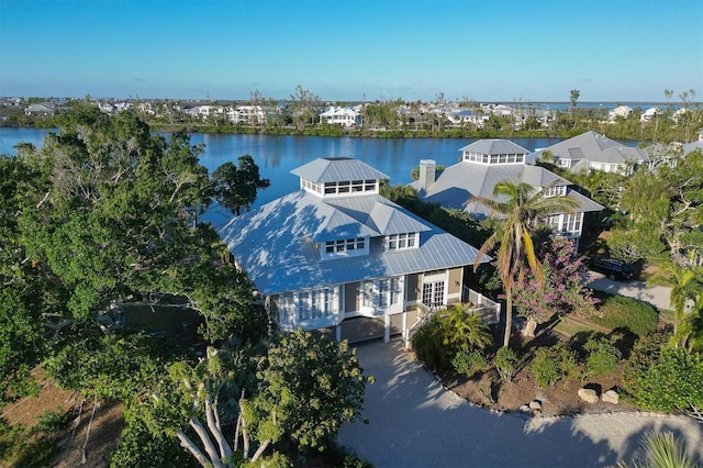 birds eye view of property with a water view