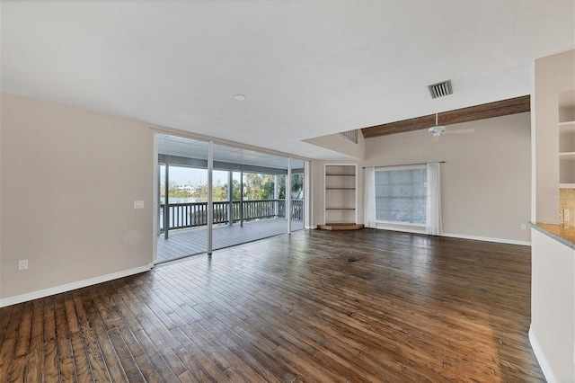 unfurnished living room featuring built in shelves, visible vents, a ceiling fan, wood finished floors, and baseboards