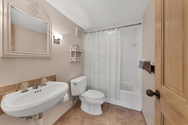 full bathroom with toilet, shower / tub combo, a sink, visible vents, and tile patterned floors