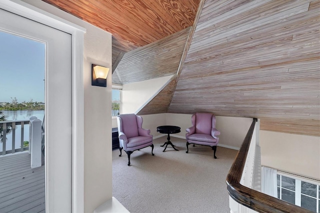 living area featuring carpet, wood ceiling, visible vents, and lofted ceiling