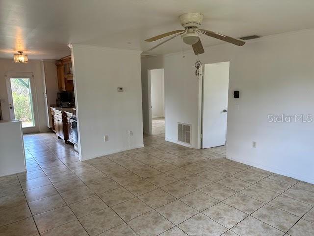 1417 Terry Ave, Punta Gorda, FL 33980 - unfurnished room featuring light tile patterned floors, visible vents, and a ceiling fan