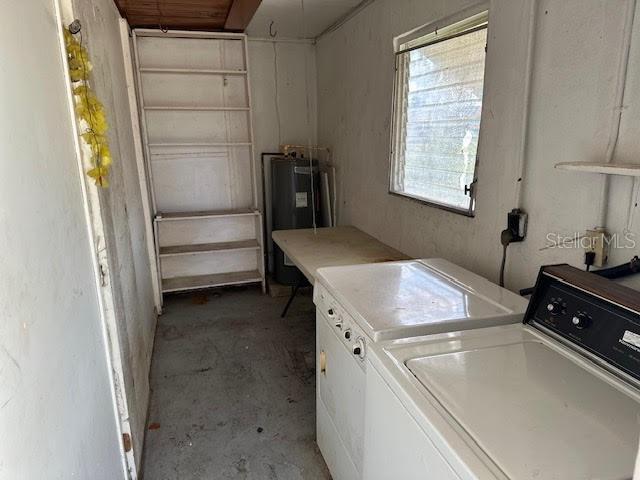1417 Terry Ave, Punta Gorda, FL 33980 - clothes washing area with laundry area, washer and clothes dryer, and electric water heater