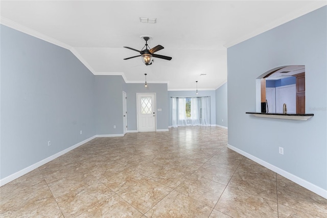 unfurnished living room with baseboards, visible vents, lofted ceiling, ceiling fan, and ornamental molding