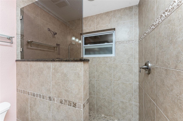 full bathroom with toilet and walk in shower