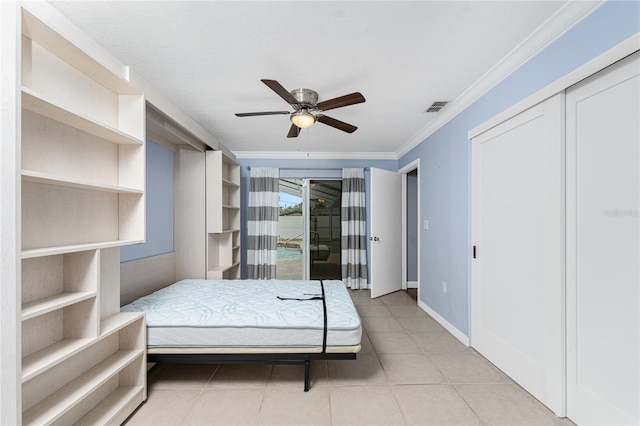 bedroom featuring visible vents, access to outside, crown molding, light tile patterned floors, and baseboards