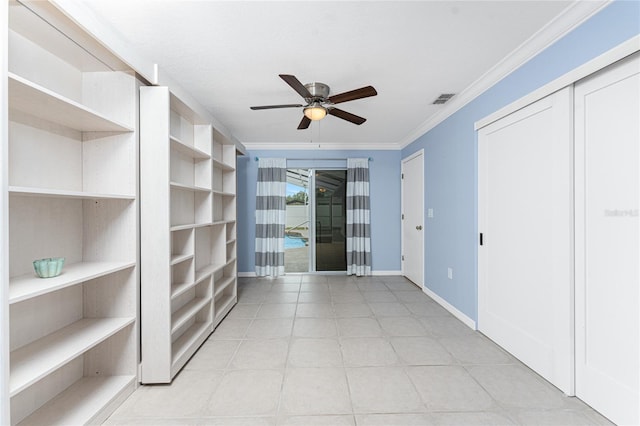 interior space featuring visible vents, baseboards, ceiling fan, ornamental molding, and light tile patterned flooring