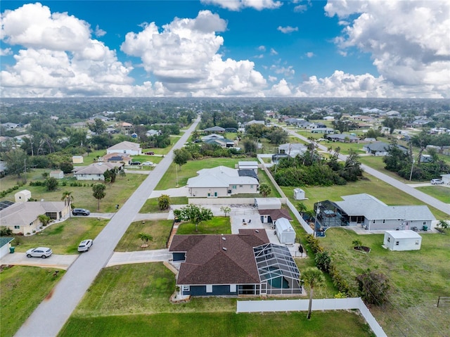 birds eye view of property with a residential view