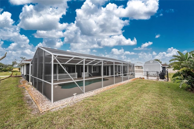 exterior space featuring glass enclosure, a gate, fence, an outdoor pool, and a lawn