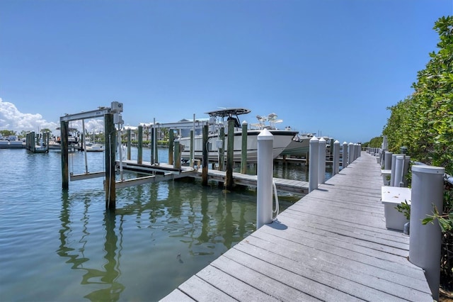 view of dock with a water view and boat lift