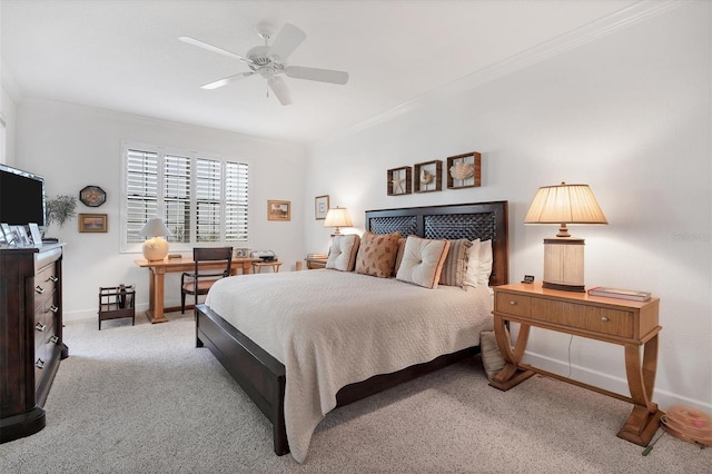 bedroom featuring a ceiling fan, carpet, crown molding, and baseboards