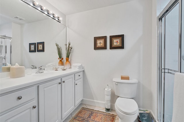 full bathroom with visible vents, tiled shower, toilet, tile patterned flooring, and vanity