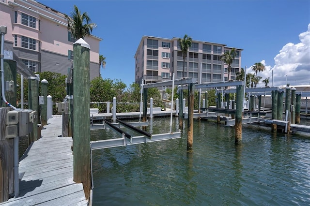 view of dock featuring a water view and boat lift