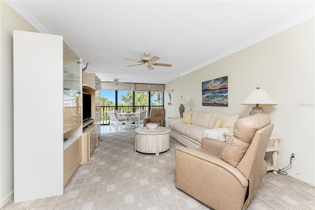 living area with a ceiling fan, light carpet, crown molding, and baseboards