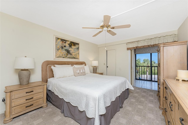 bedroom with a ceiling fan, light colored carpet, and access to exterior