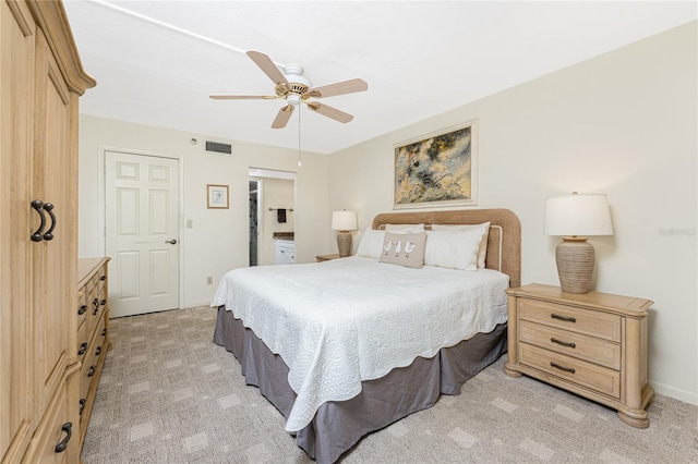 bedroom featuring light carpet, visible vents, and a ceiling fan