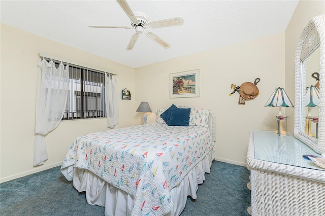 carpeted bedroom featuring a textured ceiling, a ceiling fan, and baseboards