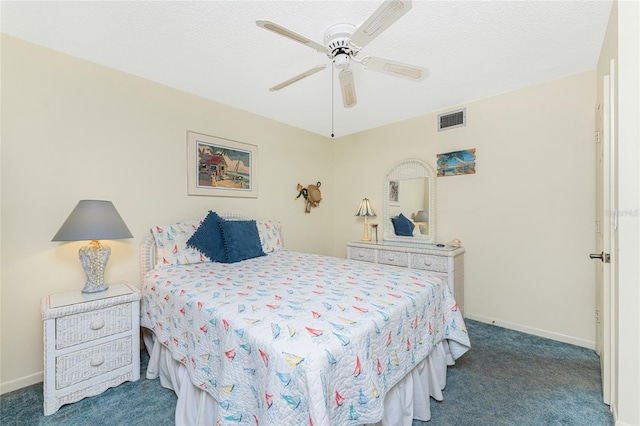 bedroom featuring baseboards, visible vents, a textured ceiling, and carpet flooring