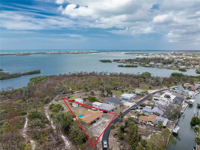 birds eye view of property featuring a water view