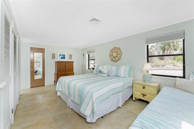 bedroom featuring visible vents