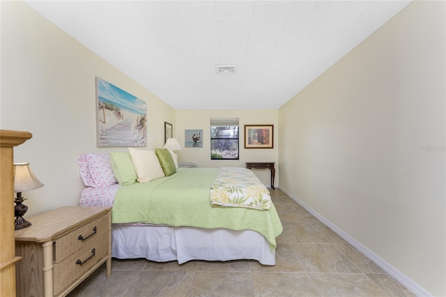 bedroom with visible vents and baseboards