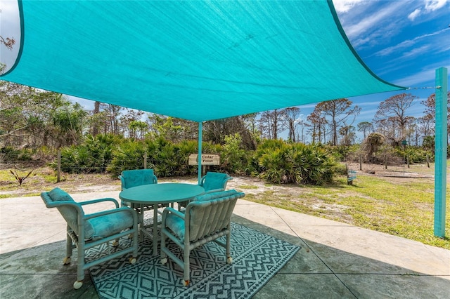 view of patio featuring outdoor dining space