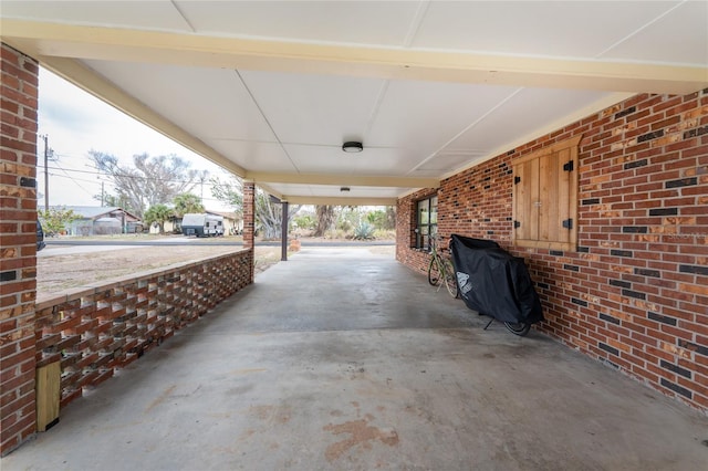 view of patio with an attached carport and area for grilling