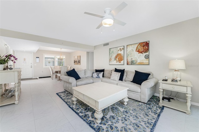 living room with light tile patterned flooring, visible vents, baseboards, and ceiling fan with notable chandelier