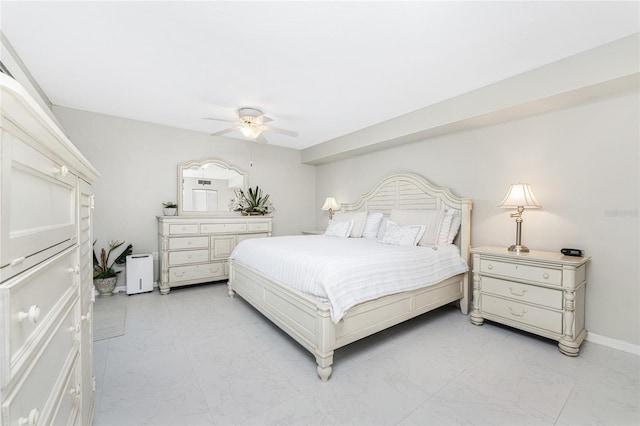 bedroom featuring marble finish floor, a ceiling fan, and baseboards