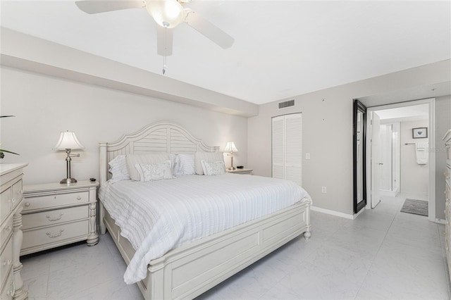 bedroom with marble finish floor, a closet, visible vents, a ceiling fan, and baseboards