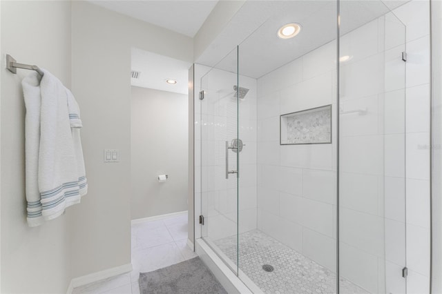 bathroom with recessed lighting, visible vents, baseboards, a shower stall, and tile patterned floors