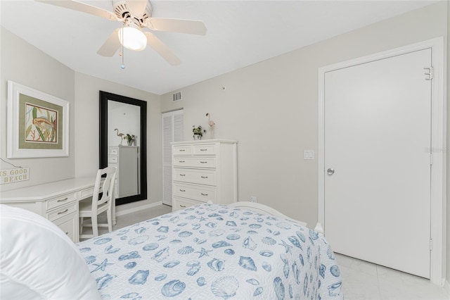 bedroom featuring light tile patterned floors, visible vents, and a ceiling fan