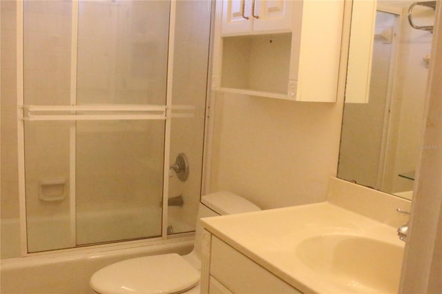 full bathroom featuring vanity, toilet, and enclosed tub / shower combo