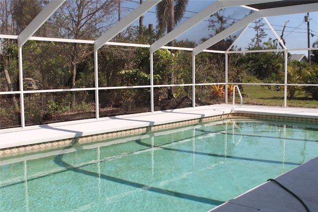 outdoor pool featuring a lanai