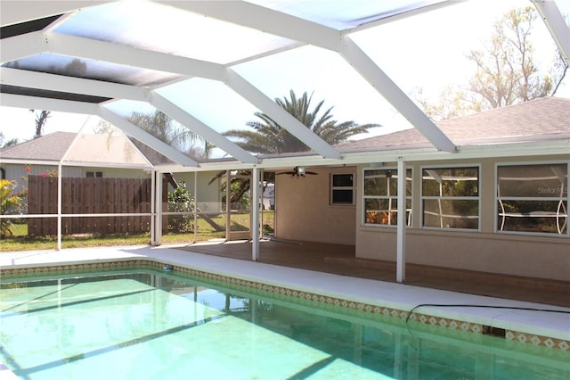 view of swimming pool featuring a patio area, a fenced in pool, a lanai, and fence