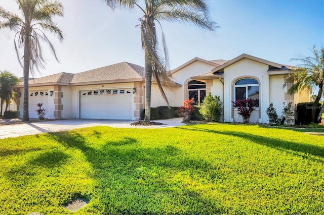 ranch-style house featuring a garage, driveway, a front lawn, and stucco siding