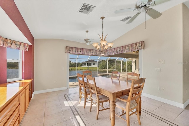 dining space featuring lofted ceiling, a sunroom, visible vents, and light tile patterned floors