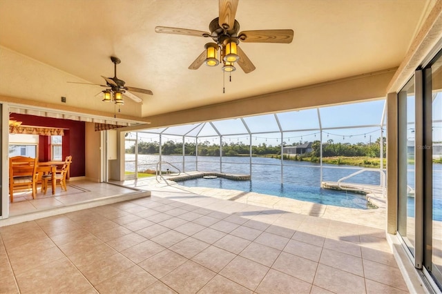 outdoor pool featuring a water view, a patio area, ceiling fan, and glass enclosure