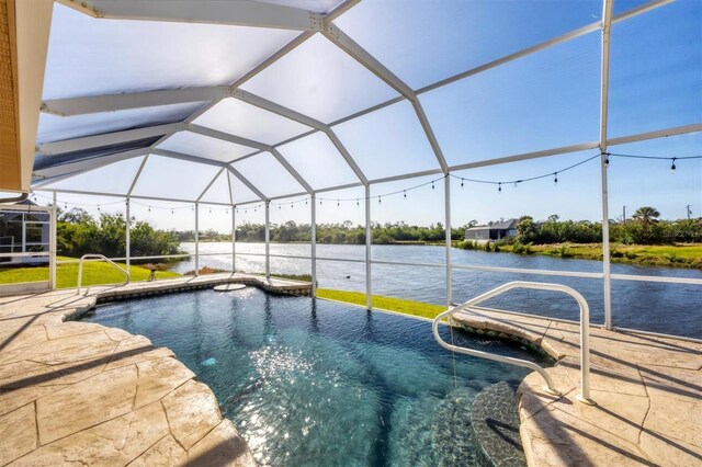 outdoor pool with a patio area, a lanai, and a water view