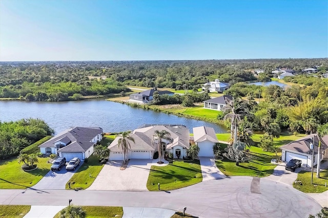 aerial view with a water view, a residential view, and a view of trees