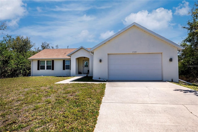 ranch-style home featuring a front yard, an attached garage, driveway, and stucco siding