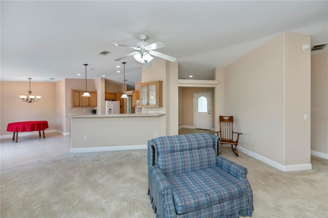 interior space featuring visible vents, light carpet, ceiling fan with notable chandelier, recessed lighting, and baseboards