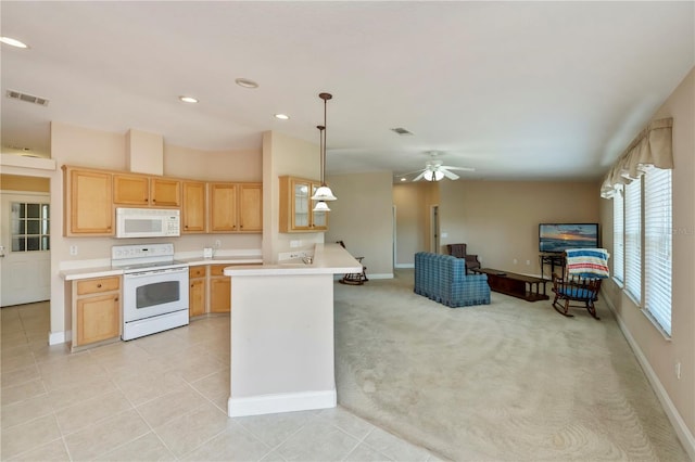 kitchen featuring visible vents, light brown cabinetry, light colored carpet, light countertops, and white appliances