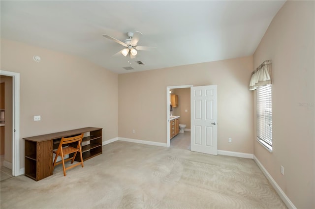 interior space with visible vents, baseboards, and ceiling fan