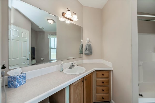 full bathroom featuring vanity and walk in shower