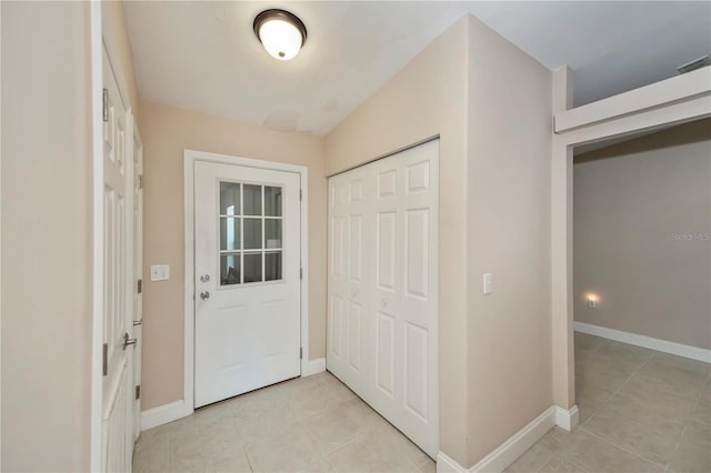 entrance foyer with light tile patterned floors, visible vents, and baseboards