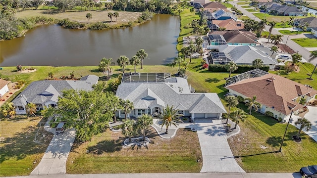 bird's eye view featuring a residential view and a water view