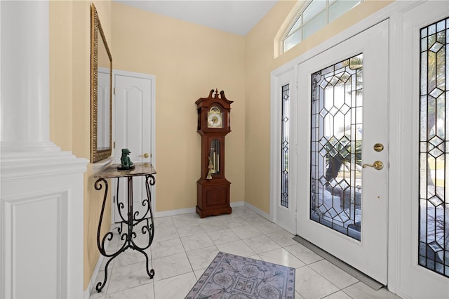 entrance foyer with plenty of natural light and baseboards